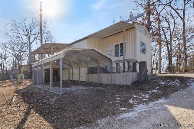 rear view of house with a carport