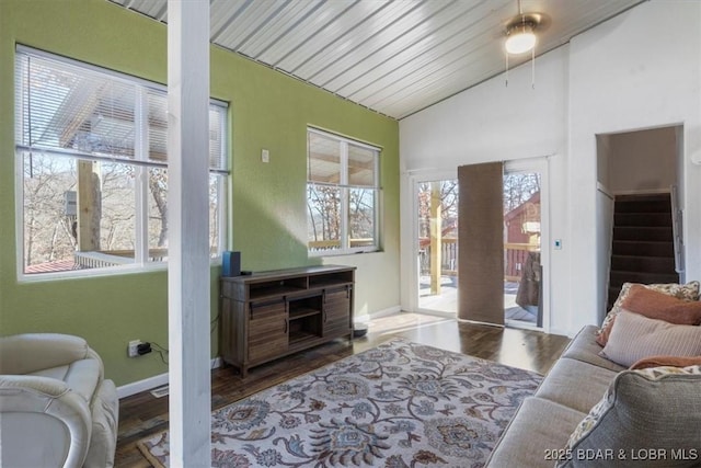 living room featuring hardwood / wood-style flooring and lofted ceiling