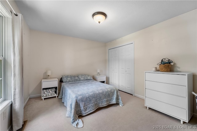 carpeted bedroom featuring a closet