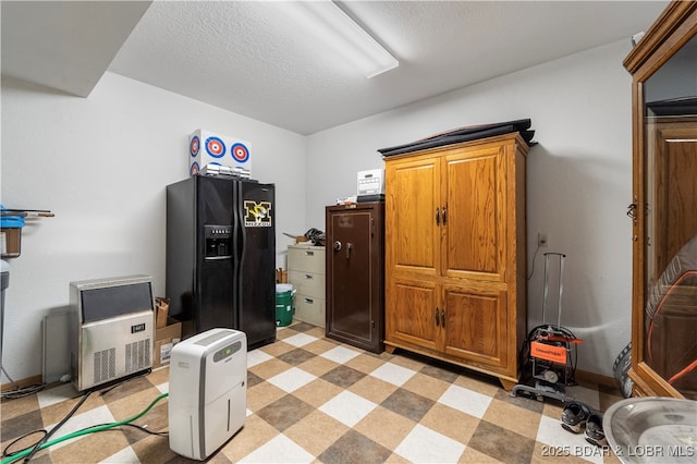 miscellaneous room with a textured ceiling