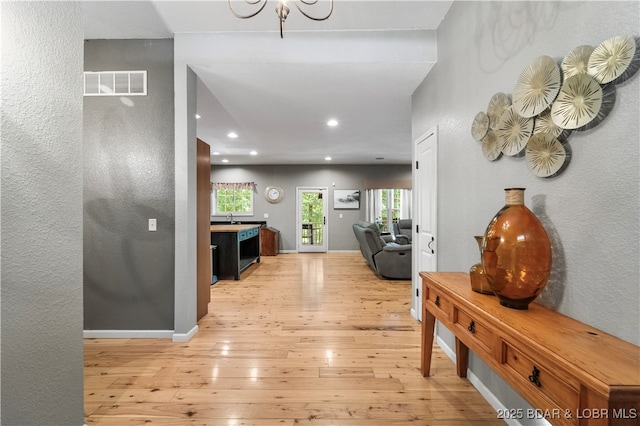 hallway featuring light hardwood / wood-style flooring