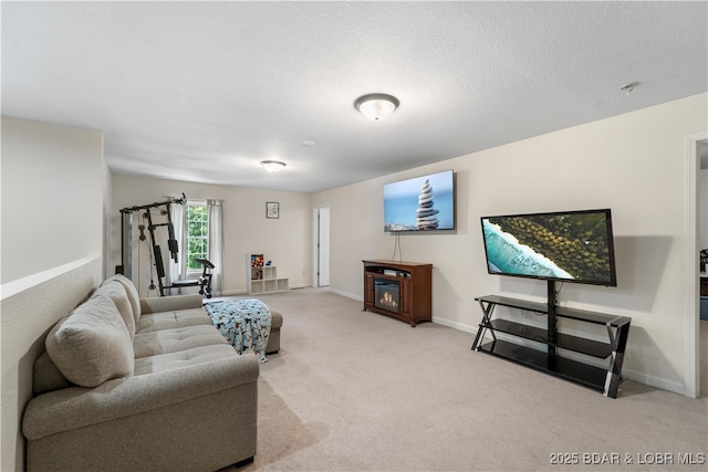 living room with carpet flooring and a textured ceiling