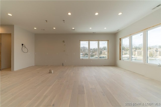 unfurnished room with light hardwood / wood-style flooring