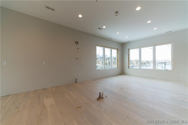 spare room featuring light hardwood / wood-style flooring