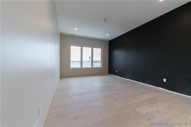 empty room with light wood-type flooring