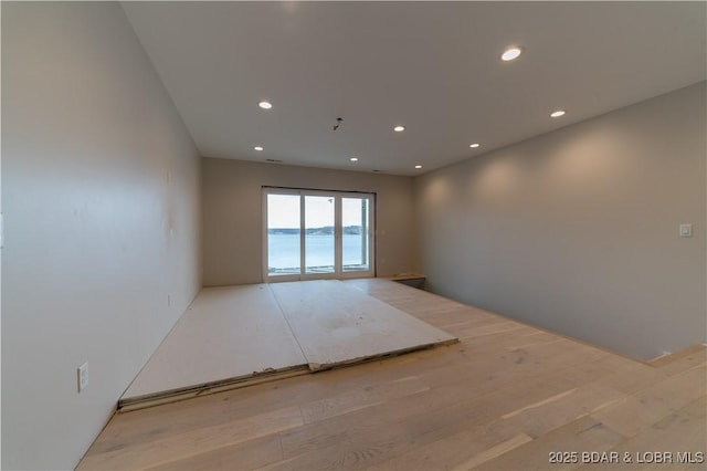 empty room featuring wood finished floors and recessed lighting