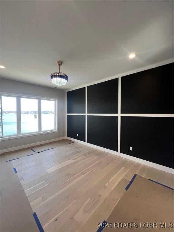 empty room featuring recessed lighting and wood finished floors