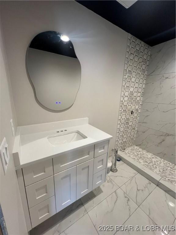 439 Redbud Ln, Lake Ozark, MO 65049 - full bathroom featuring marble look tiles, vanity, and a shower stall