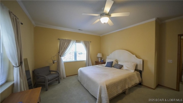 carpeted bedroom featuring ceiling fan and ornamental molding