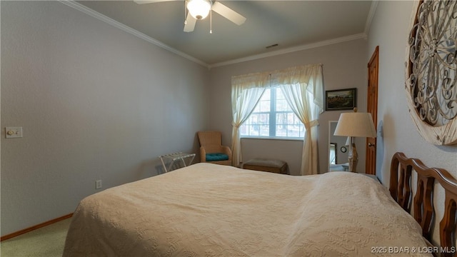 carpeted bedroom with crown molding and ceiling fan