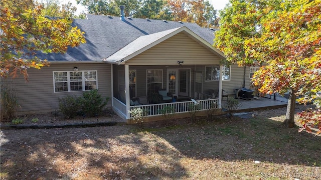 rear view of property with central AC, a sunroom, and a patio