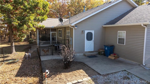 entrance to property featuring a patio area