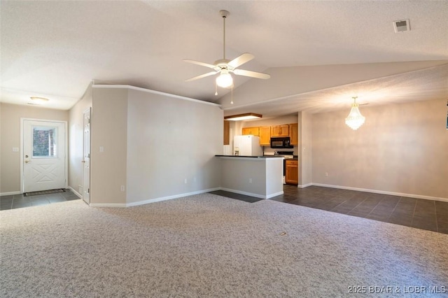 unfurnished living room with ceiling fan, lofted ceiling, and dark colored carpet