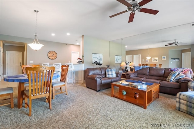 living room featuring light carpet and ceiling fan