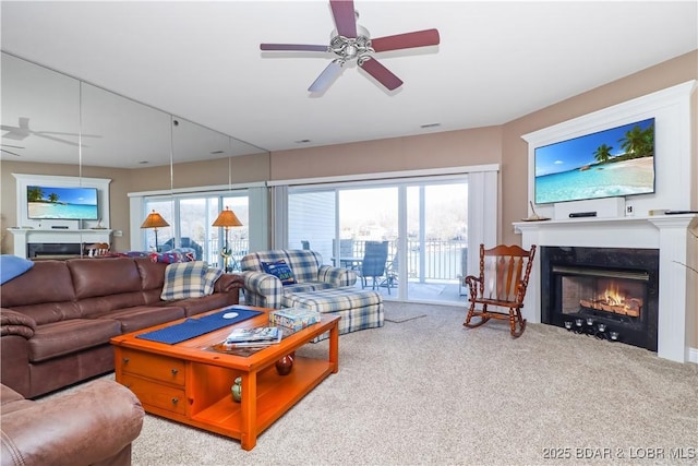 living room with light carpet, ceiling fan, and a healthy amount of sunlight