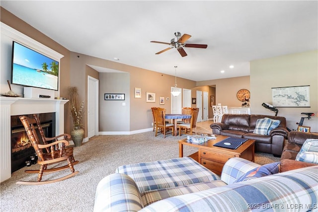 living room with carpet floors and ceiling fan