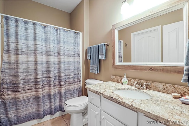 bathroom with tile patterned flooring, vanity, a shower with curtain, and toilet