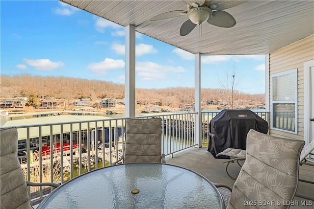 balcony with area for grilling and ceiling fan