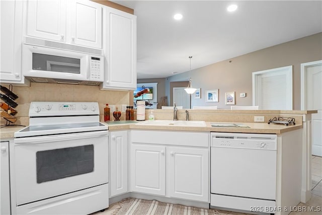 kitchen featuring sink, white cabinetry, decorative light fixtures, white appliances, and decorative backsplash