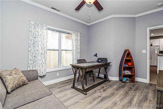 office with wood-type flooring, plenty of natural light, and crown molding