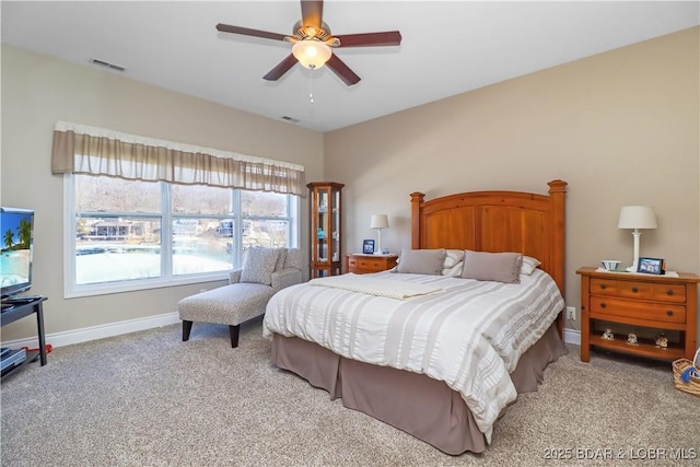 bedroom featuring ceiling fan and light colored carpet