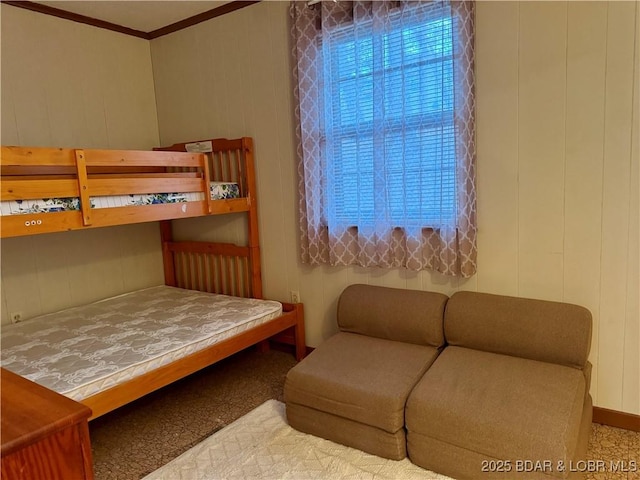 carpeted bedroom featuring crown molding