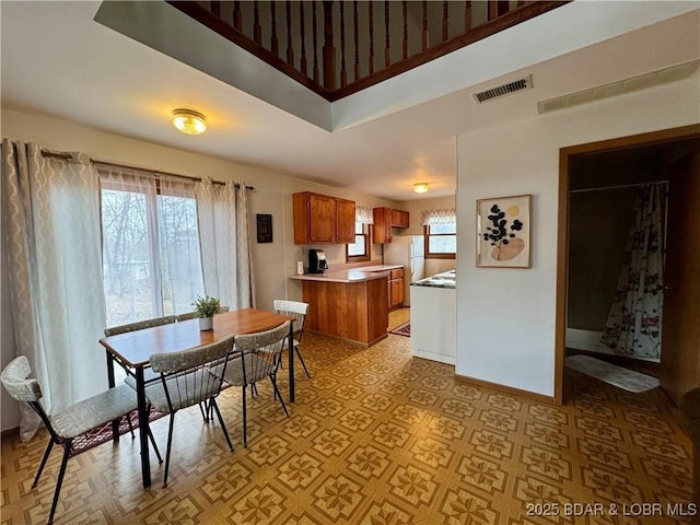 dining room featuring light parquet floors