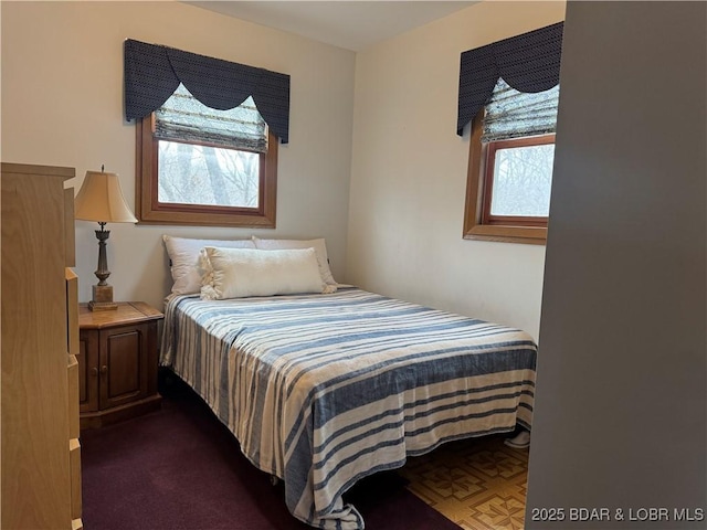 bedroom with multiple windows