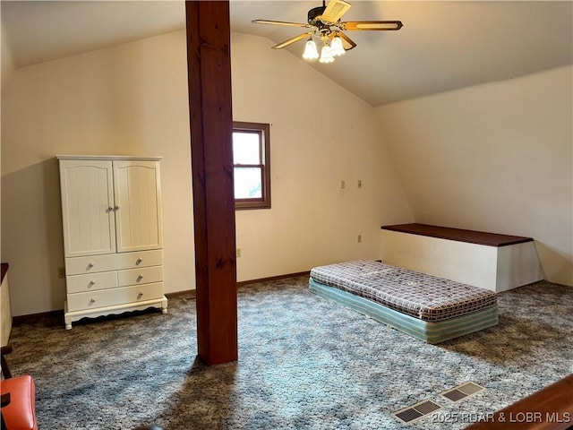 unfurnished bedroom featuring ceiling fan, lofted ceiling, and dark carpet