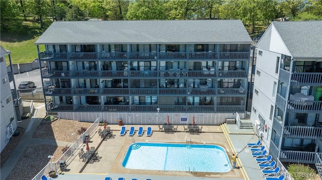 view of building exterior with a community pool