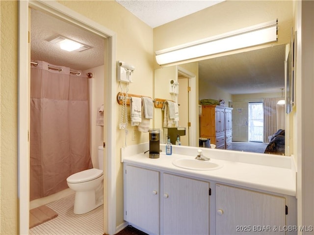 bathroom featuring tile patterned flooring, a shower with shower curtain, vanity, a textured ceiling, and toilet