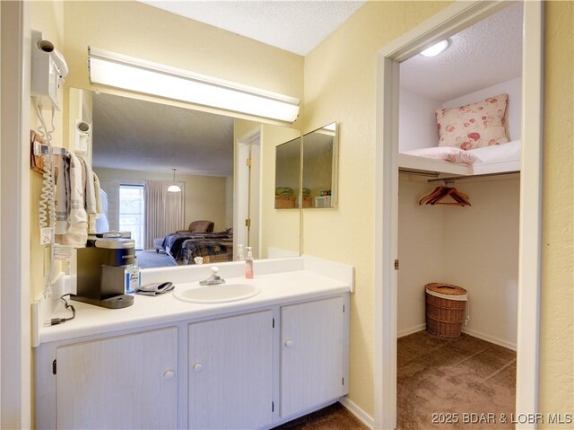 bathroom featuring vanity and a textured ceiling