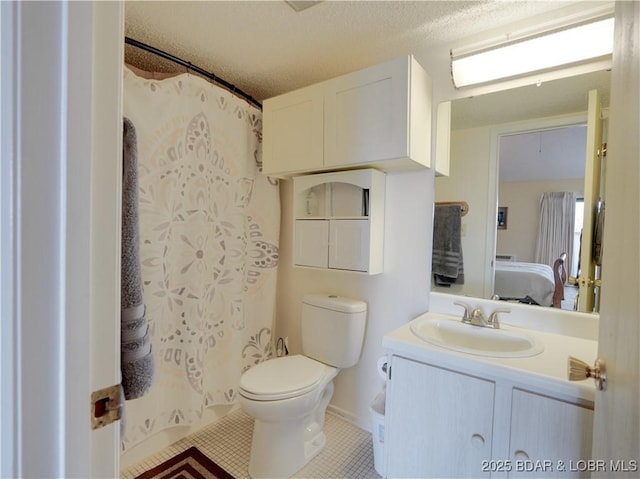 bathroom featuring tile patterned flooring, vanity, toilet, a textured ceiling, and a shower with curtain