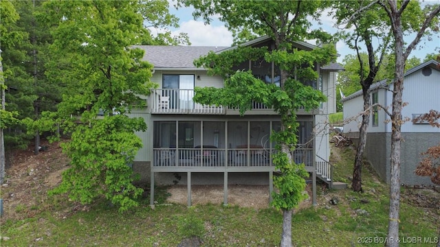161 Lubbers Quarters, Osage Beach, MO 65065 - rear view of house with a sunroom, a balcony, and a shingled roof