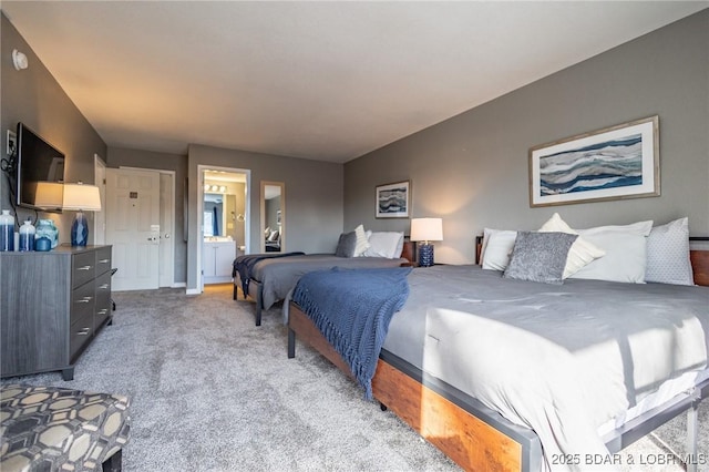 carpeted bedroom featuring ensuite bathroom