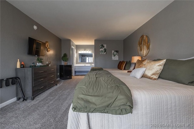 carpeted bedroom featuring connected bathroom