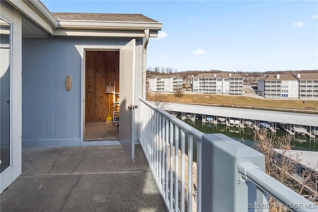 balcony featuring a water view