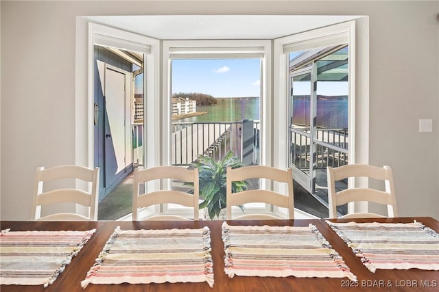 dining room with a water view