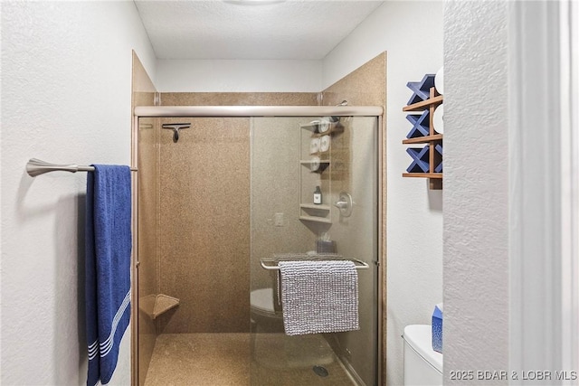 bathroom with walk in shower and toilet