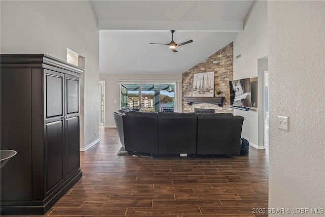 living room featuring dark wood-type flooring, high vaulted ceiling, beamed ceiling, and ceiling fan