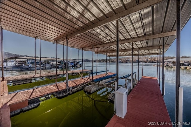 view of dock featuring a water view and boat lift