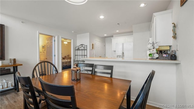 dining area with light hardwood / wood-style flooring