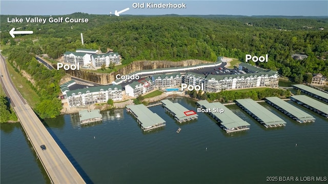 birds eye view of property featuring a water view