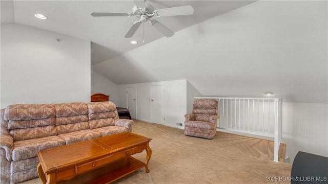 carpeted living room featuring vaulted ceiling and ceiling fan