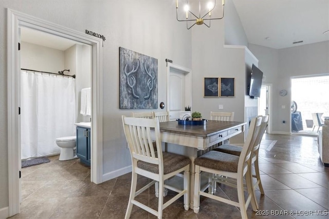 dining area featuring a notable chandelier