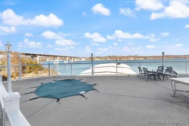 view of swimming pool with a water view