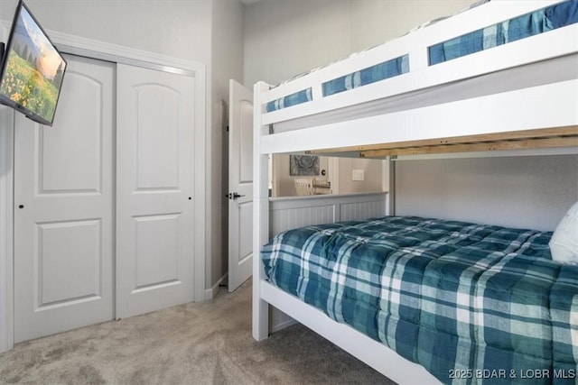 carpeted bedroom with a closet