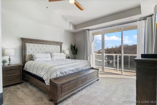 carpeted bedroom featuring access to outside and ceiling fan