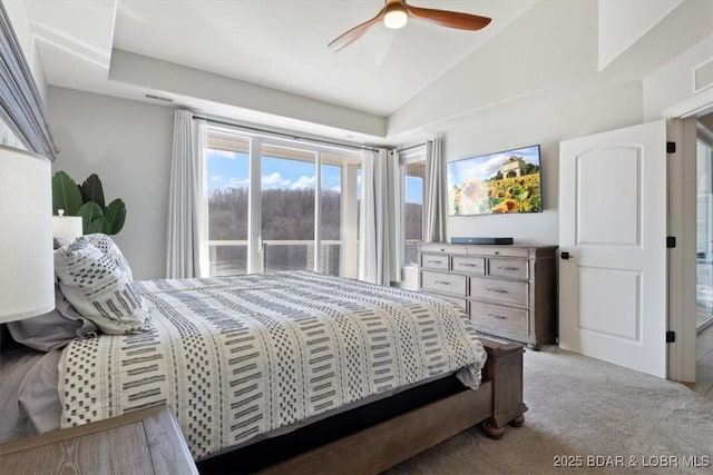 bedroom featuring vaulted ceiling, ceiling fan, and light colored carpet