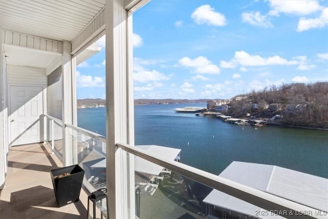 balcony featuring a water view